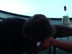Sexy femdom smoking a cigarette while getting feet licked and toes sucked by Foot Girls