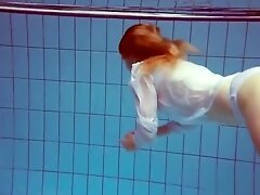 Redhead in a white dress and sexy bikini