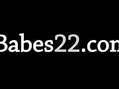 glamorous blonde on the black couch